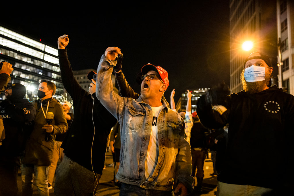 Trump supporters break Black Lives Matter signs in DC